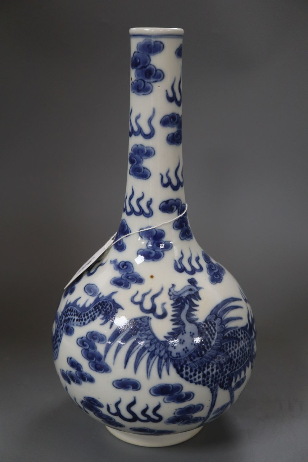 A Chinese blue and white dragon bottle vase, with Kangxi mark, height 32cm